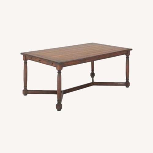 Used Coventry Light Brown Wood Dining Table for sale on AptDeco