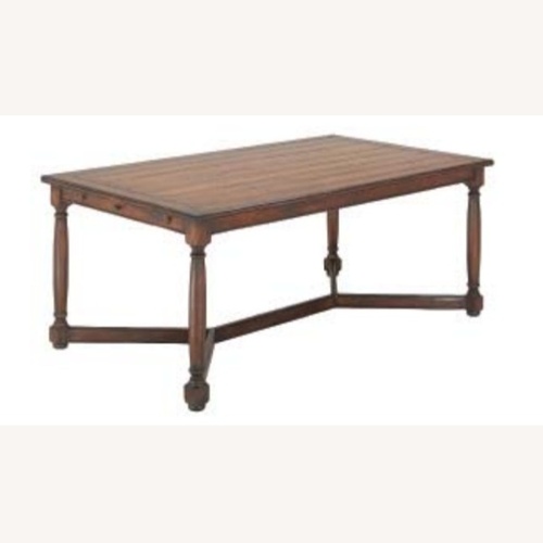 Used Coventry Light Brown Wood Dining Table for sale on AptDeco