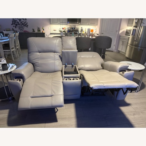 Used Triple Power Reclining Gray Leather Loveseat for sale on AptDeco