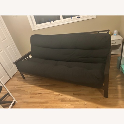 Used Futon World Dark Brown Wood Futon for sale on AptDeco