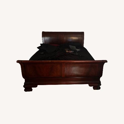Used Dark Brown Wood King Bed for sale on AptDeco