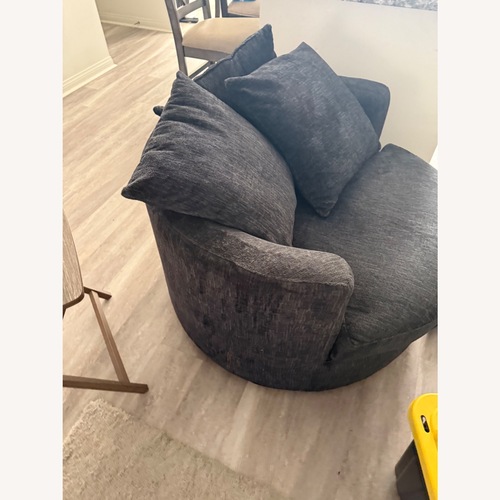 Used Living Spaces Oversized Swivel Lounge Chair for sale on AptDeco