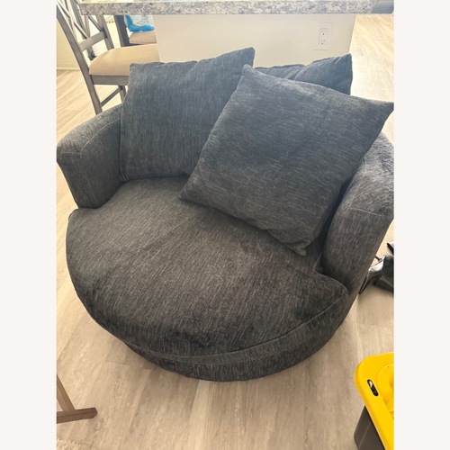 Used Living Spaces Oversized Swivel Lounge Chair for sale on AptDeco