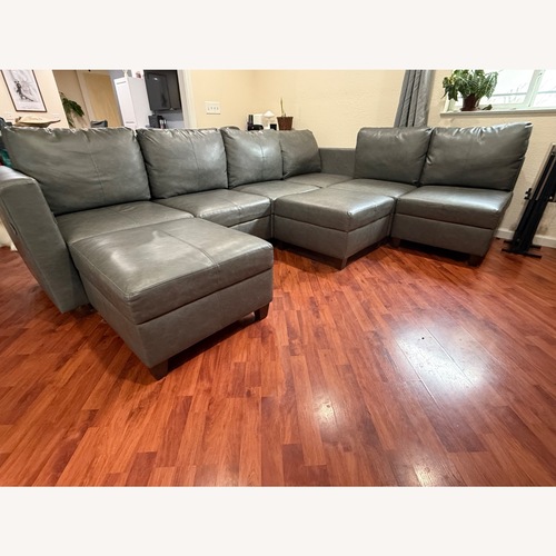 Used Dark Gray Faux Leather 3+ Piece Sectional for sale on AptDeco