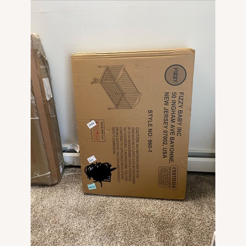 Used Fizzy Baby Dark Brown Crib for sale on AptDeco