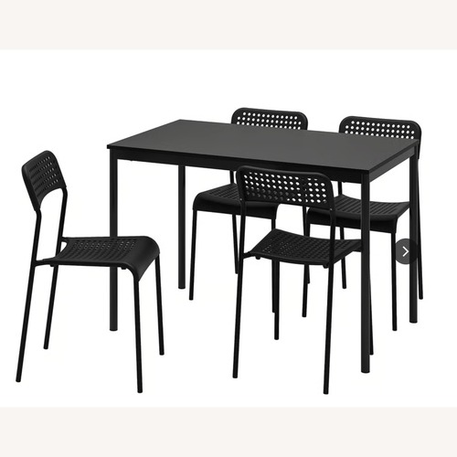 Used IKEA Sandsberg Dark Brown Wood Dining Table for sale on AptDeco