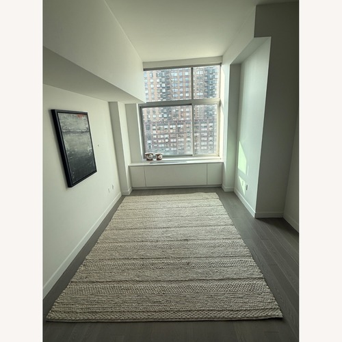 Used Surya Wool Ivory 8'x10' Area Rug for sale on AptDeco