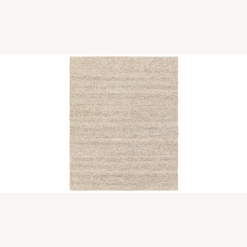 Used Surya Wool Ivory 8'x10' Area Rug for sale on AptDeco