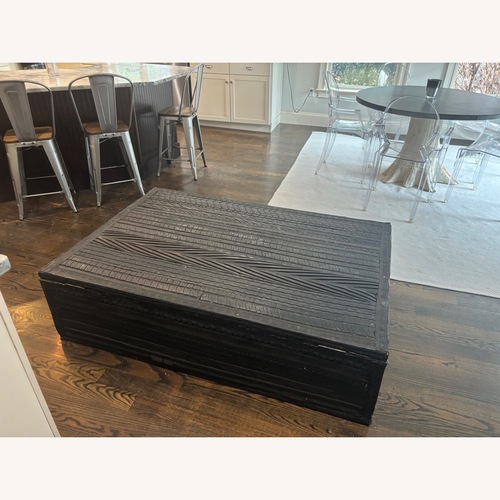 Used Montauk Sofa Tire Table Black Coffee Table for sale on AptDeco