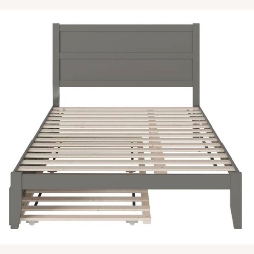 Used Dark Gray Wood Queen Bed for sale on AptDeco
