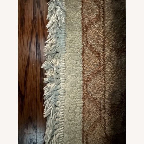 Used Natural Wool Area Rug 9' x 12' for sale on AptDeco
