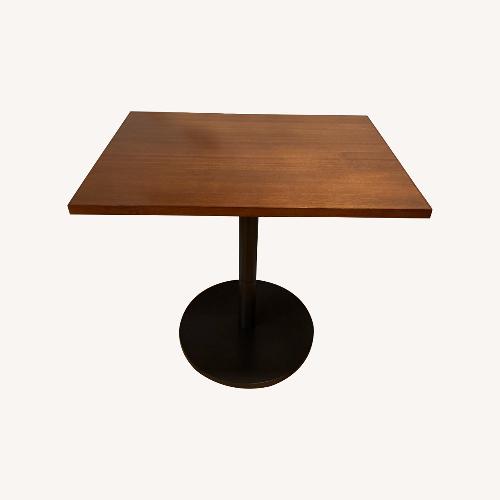 Used West Elm Orbit Dark Brown Wood Dining Table for sale on AptDeco