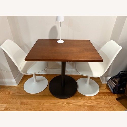 Used West Elm Orbit Dark Brown Wood Dining Table for sale on AptDeco