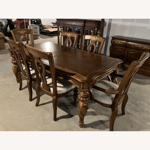 Used Dining Table With Six Chairs and a Leaf for sale on AptDeco