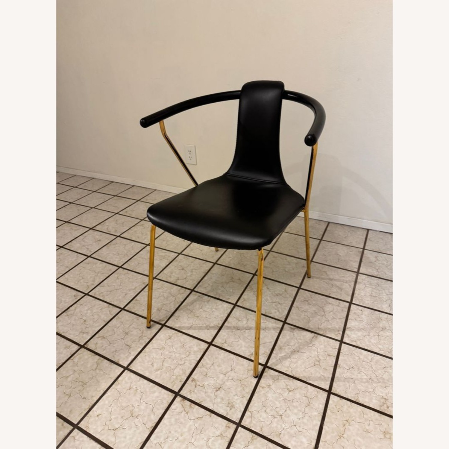 Sleek Black Modern Armchair with Gold Metal Frame - image-1