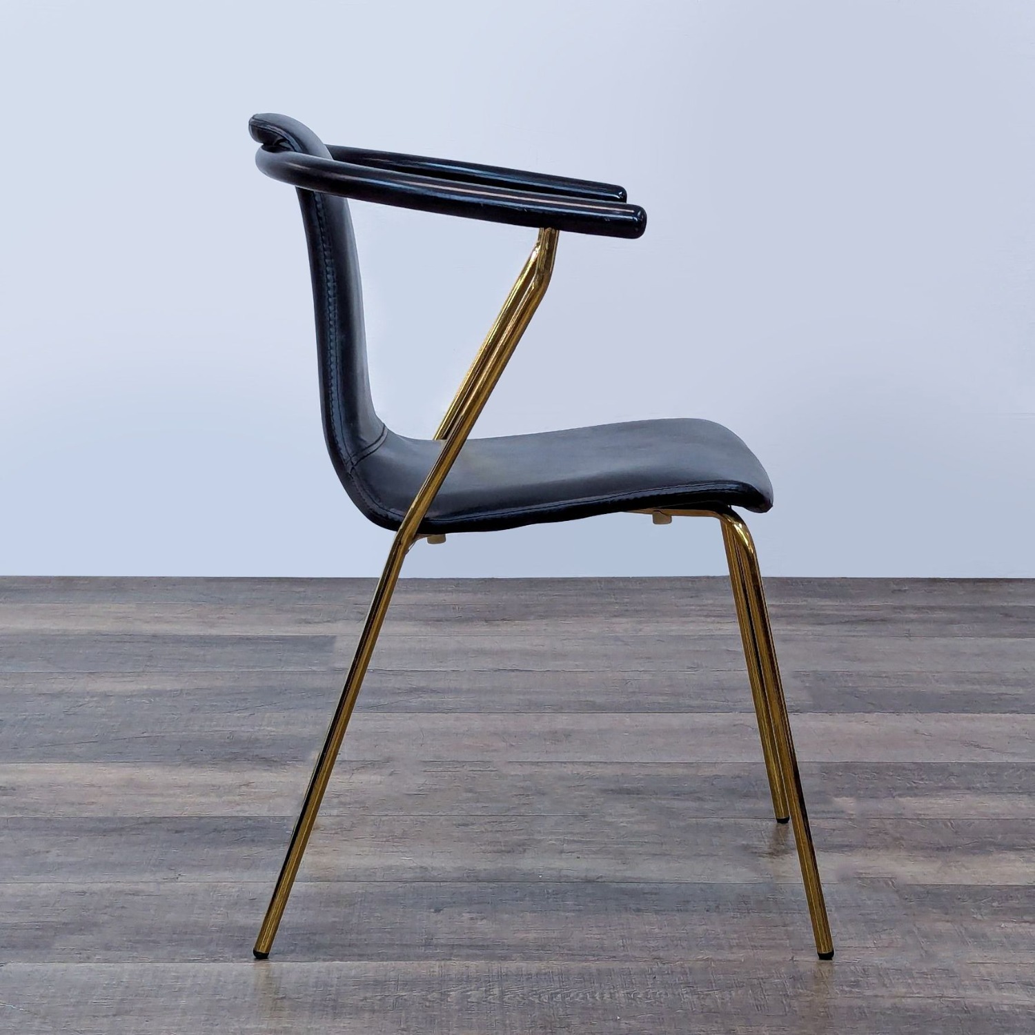 Sleek Black Modern Armchair with Gold Metal Frame - image-3