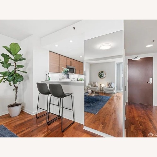 Used Living Spaces Cobbler Faux Leather Bucket Seat for sale on AptDeco