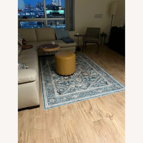 Used Upholstered Ottoman with Nailhead Trim	 for sale on AptDeco