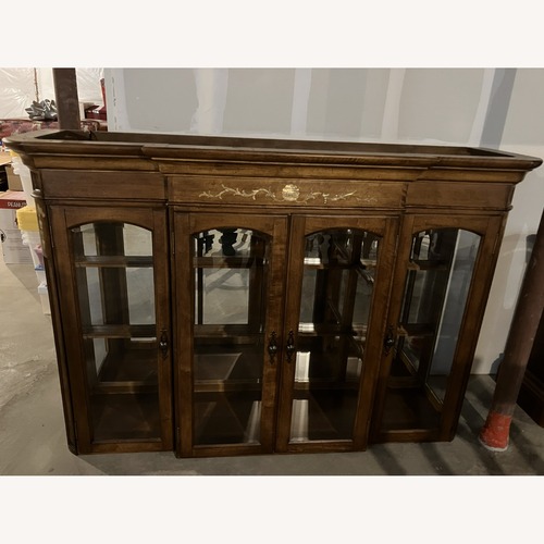 Used Kathy Ireland Home Light Brown Wood Armoire for sale on AptDeco
