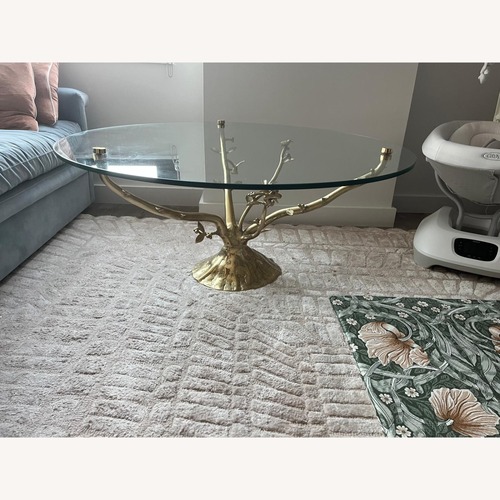 Used Anthropologie Gold Tree Glass Coffee Table for sale on AptDeco