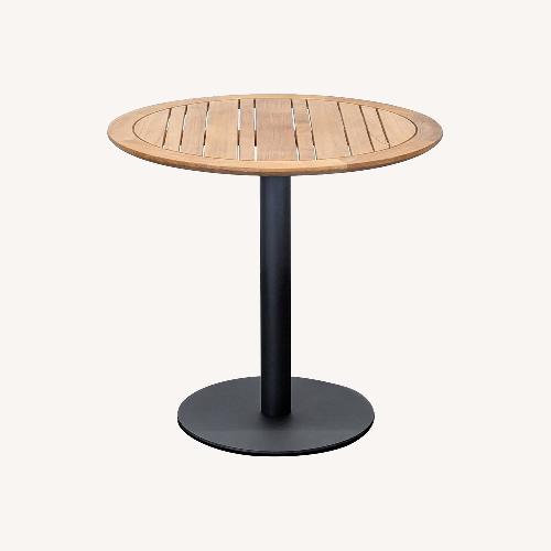 Used Ventana Round Wood Top Table with Black Metal Base for sale on AptDeco