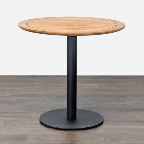 Used Ventana Round Wood Top Table with Black Metal Base for sale on AptDeco
