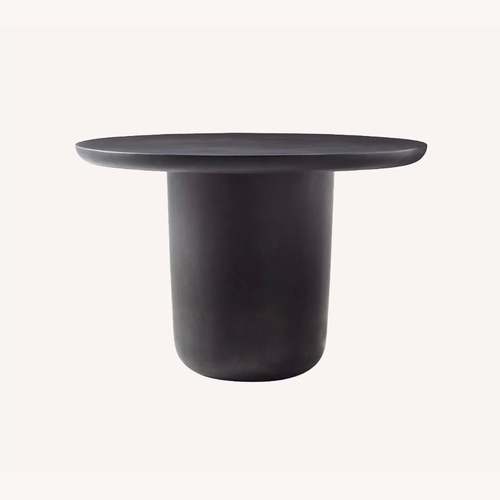 Used CB2 Lola Black Concrete Dining Table for sale on AptDeco