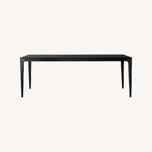 Used Arhaus Park Black Wood Dining Table for sale on AptDeco