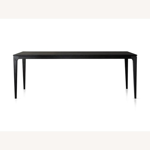Used Arhaus Park Black Wood Dining Table for sale on AptDeco