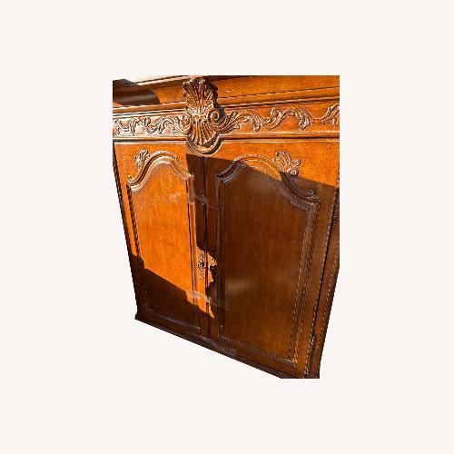 Used Classic Home Light Brown Wood Armoire for sale on AptDeco