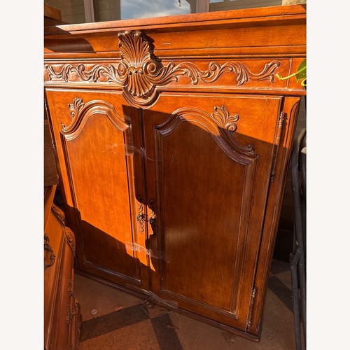 Used Classic Home Light Brown Wood Armoire for sale on AptDeco