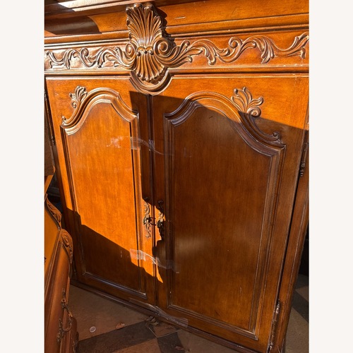 Used Classic Home Light Brown Wood Armoire for sale on AptDeco