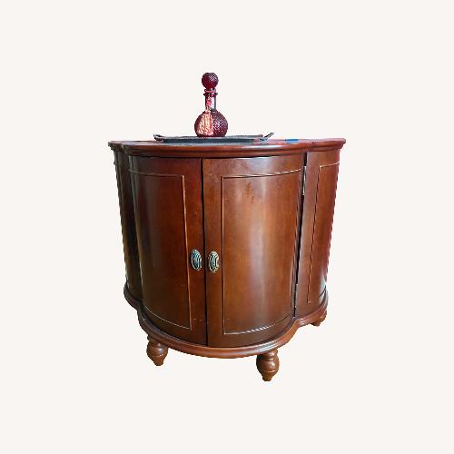 Used Bombay Co. Dark Brown Wood Bar Cabinet for sale on AptDeco