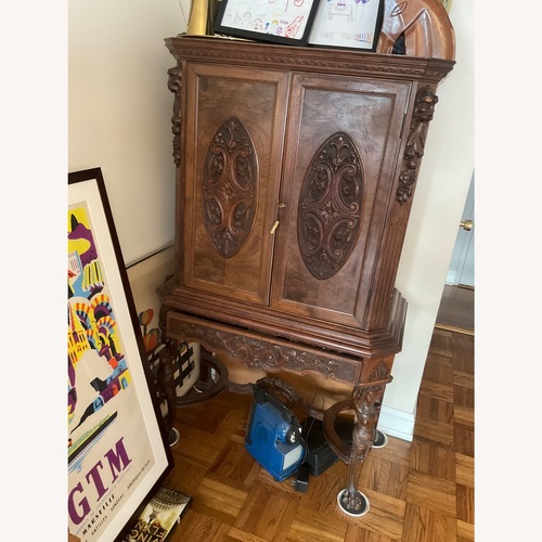 Used Dark Brown Wood Armoire for sale on AptDeco