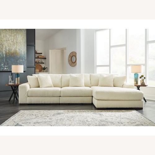 Used Ashley White Cotton 3+ Piece Sectional for sale on AptDeco