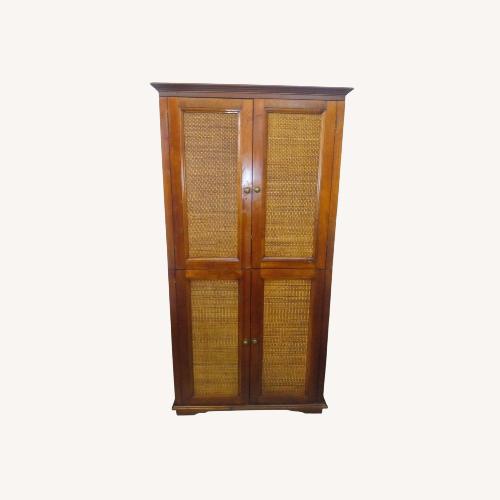 Used Pier 1 Imports Rattan Armoire for sale on AptDeco