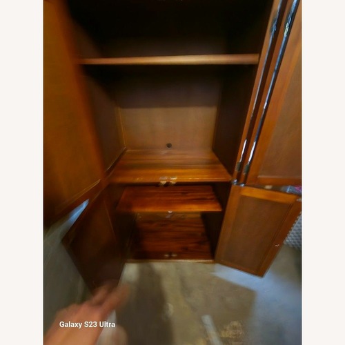 Used Pier 1 Imports Rattan Armoire for sale on AptDeco