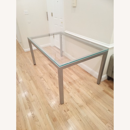Used Gray Glass Dining Table Clear Glass Gray Base for sale on AptDeco
