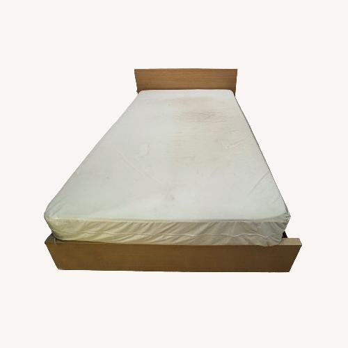 Used Light Brown Wood Queen Bed with Under Bed Storage for sale on AptDeco