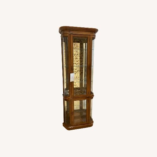 Used Pulaski Illuminated Curved Oak Curio Cabinet for sale on AptDeco