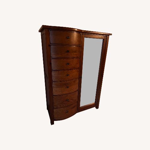 Used Vintage/Antique Finds Dark Brown Wood Armoire for sale on AptDeco