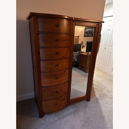 Used Vintage/Antique Finds Dark Brown Wood Armoire for sale on AptDeco