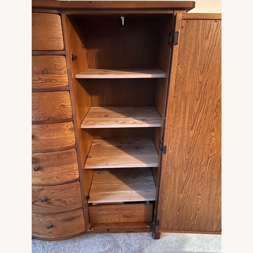 Used Vintage/Antique Finds Dark Brown Wood Armoire for sale on AptDeco