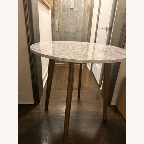 Used Light Gray Dining Table for sale on AptDeco