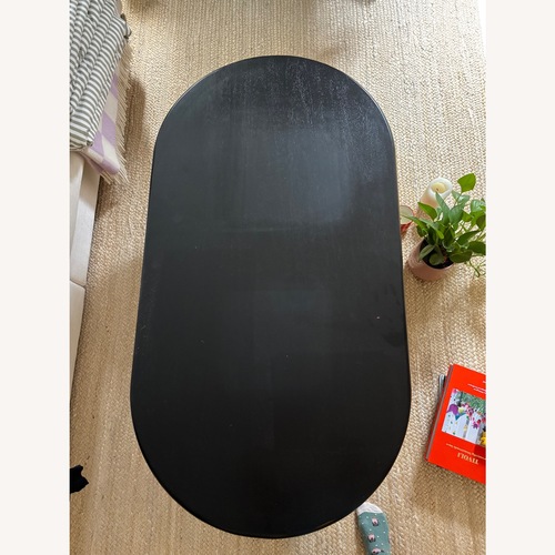 Used Four Hands Black Wood Coffee Table for sale on AptDeco