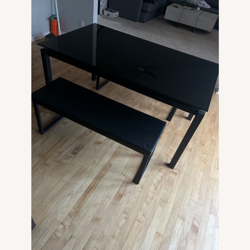 Used Black Glass Dining Table for sale on AptDeco