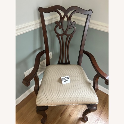 Used Vintage/Antique Dark Brown Wood Armchair for sale on AptDeco