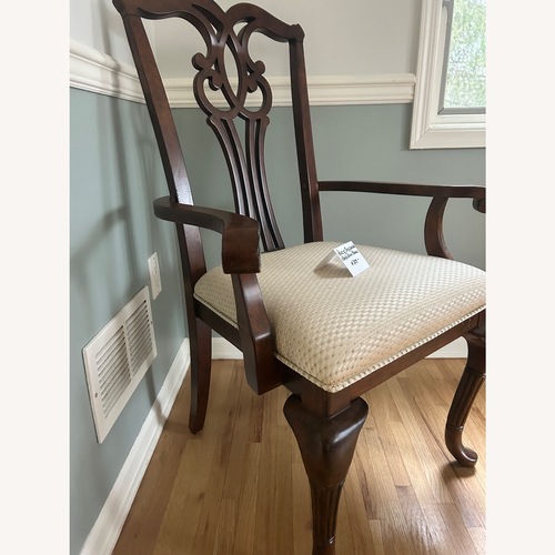 Used Vintage/Antique Dark Brown Wood Armchair for sale on AptDeco