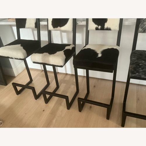 Used Black and WhiteWowhide Counter Stools  for sale on AptDeco