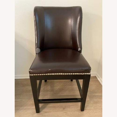 Used Dark Brown Leather Dining Chair for sale on AptDeco